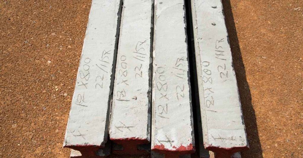 Four concrete test slabs with markings on surface
