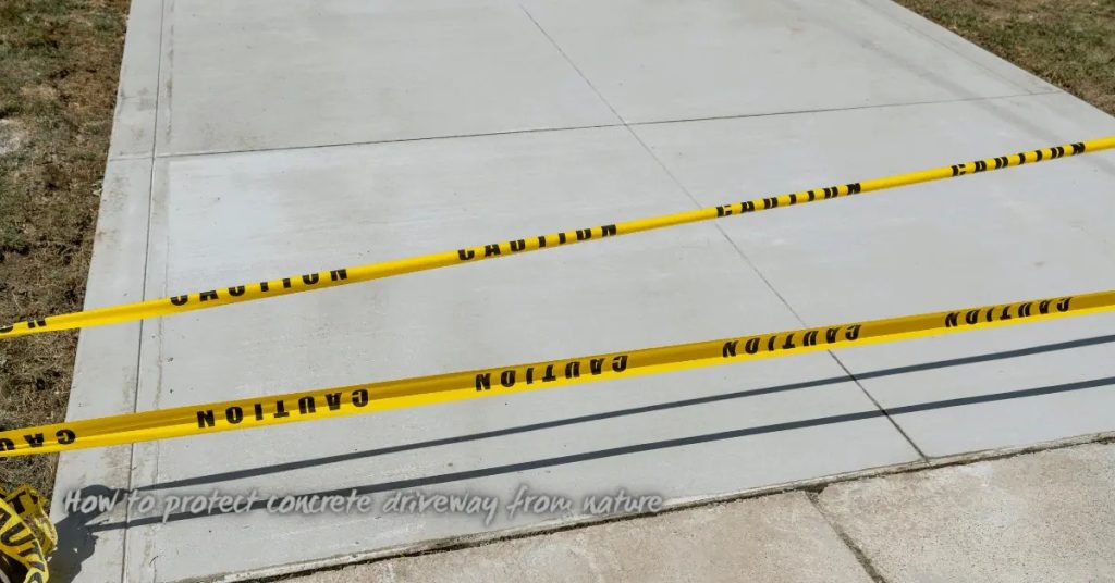 Fresh concrete driveway section with yellow caution tape