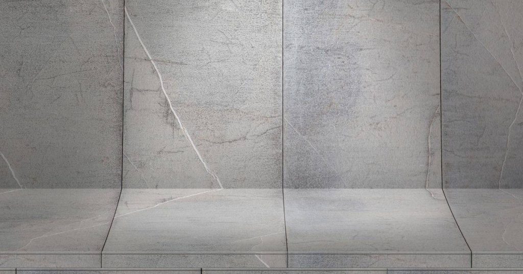 gray concrete surface with visible cracks crossing joints