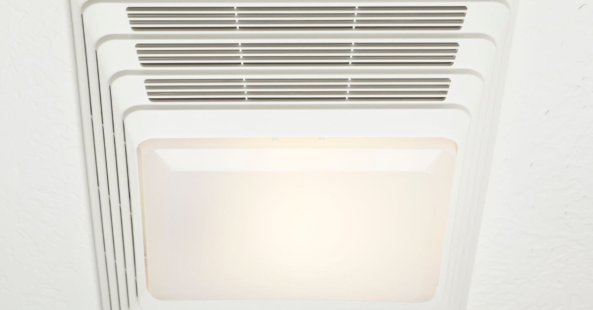 Ceiling vent with integrated light fixture in white ceiling