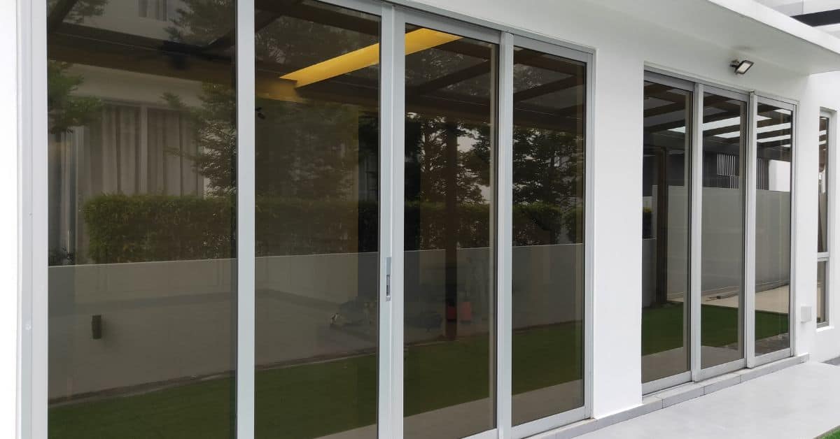 Modern home with large glass sliding doors and white walls