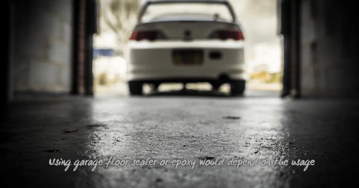 Close-up of textured garage floor with white car in background
