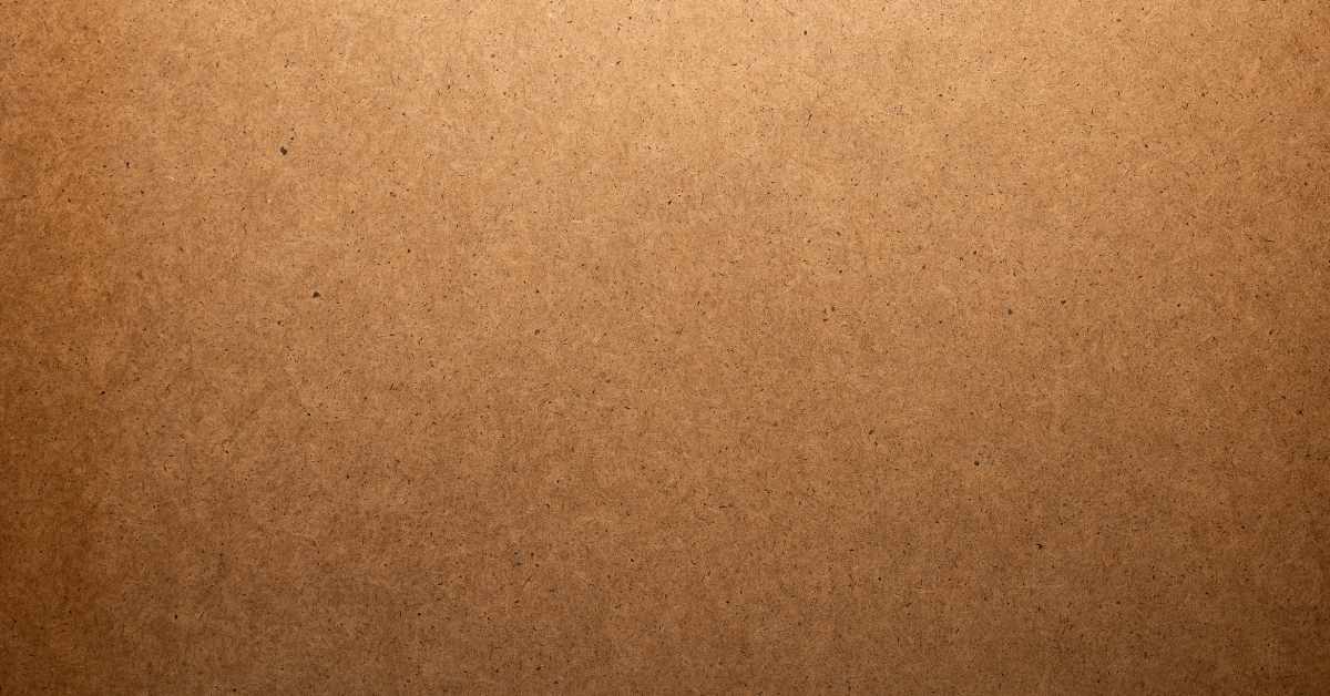 Close-up of textured hardboard surface in brown color