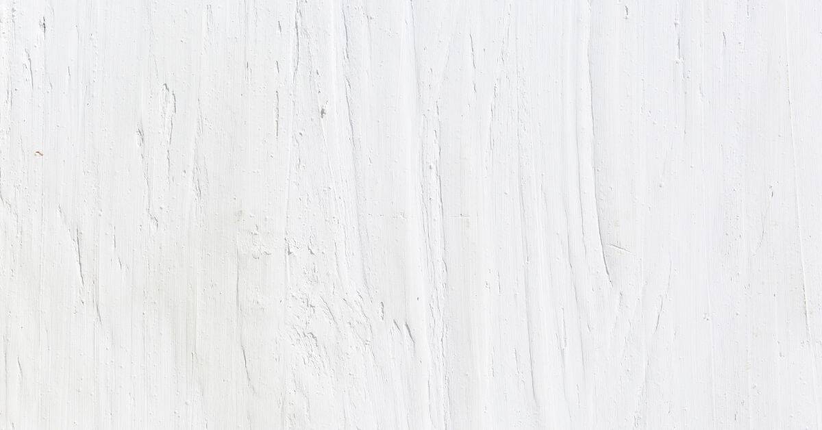 Close-up of white painted wood surface showing grain texture
