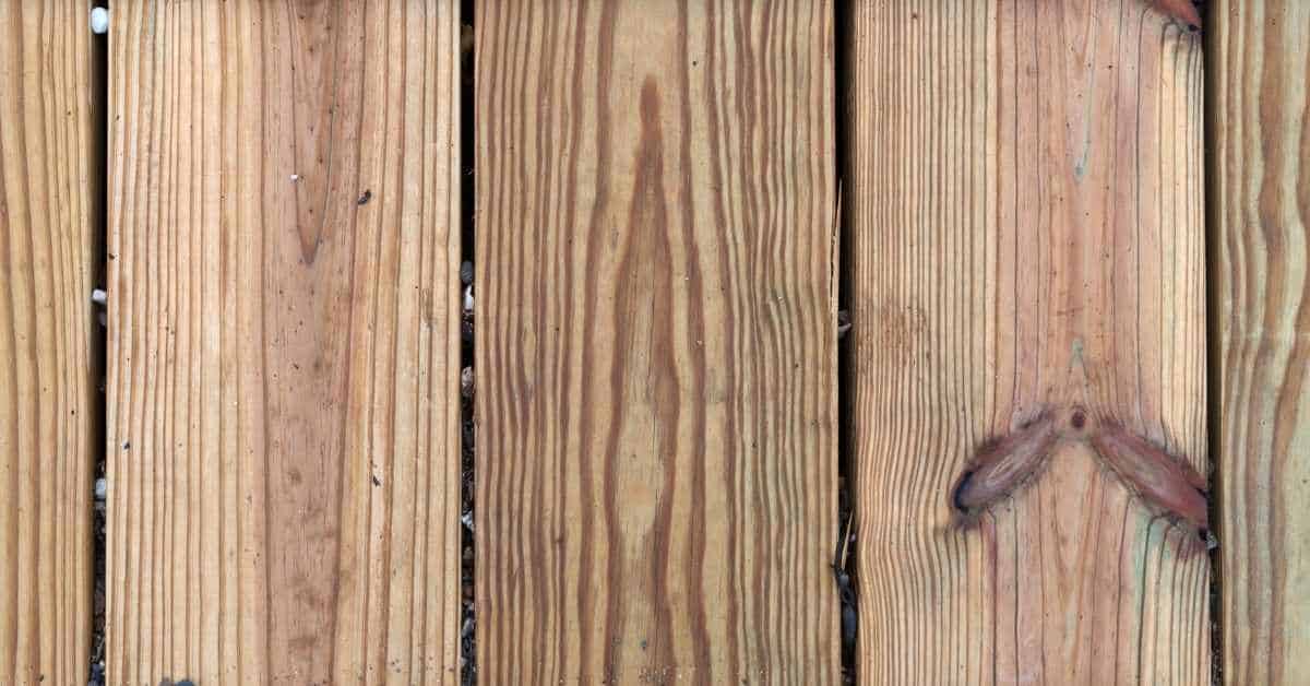 Closeup of wooden decking planks with visible grain and knots