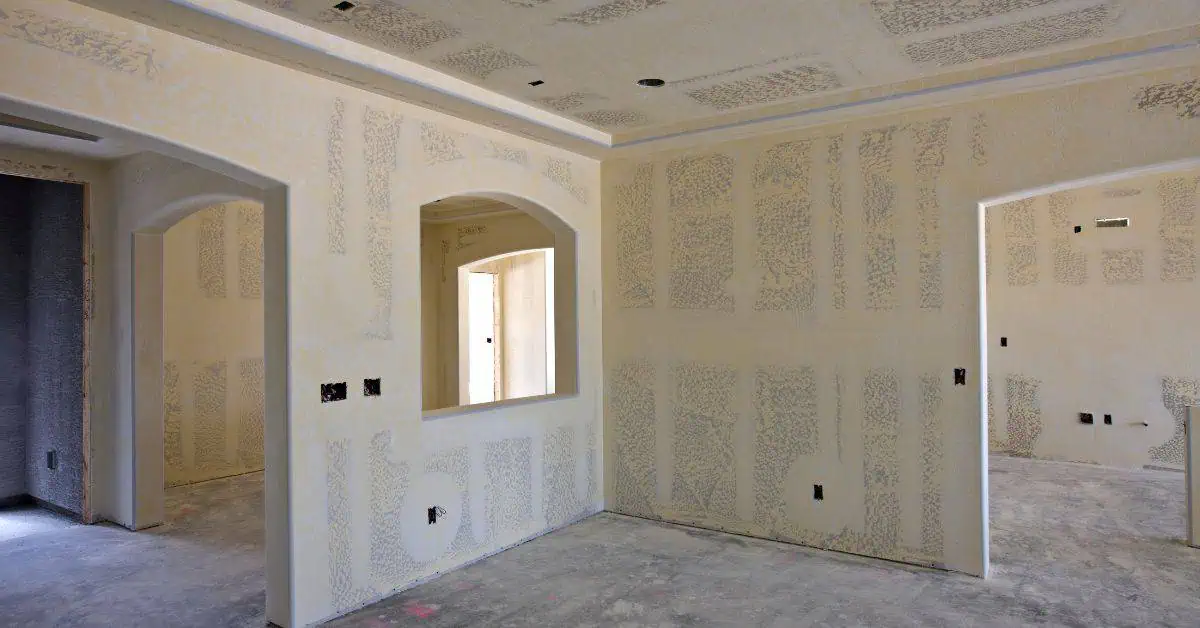 Interior walls with joint compound patches on drywall