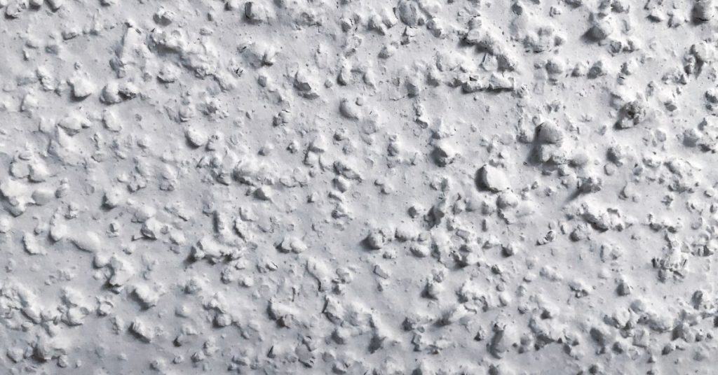 close-up of rough bumpy plaster surface texture