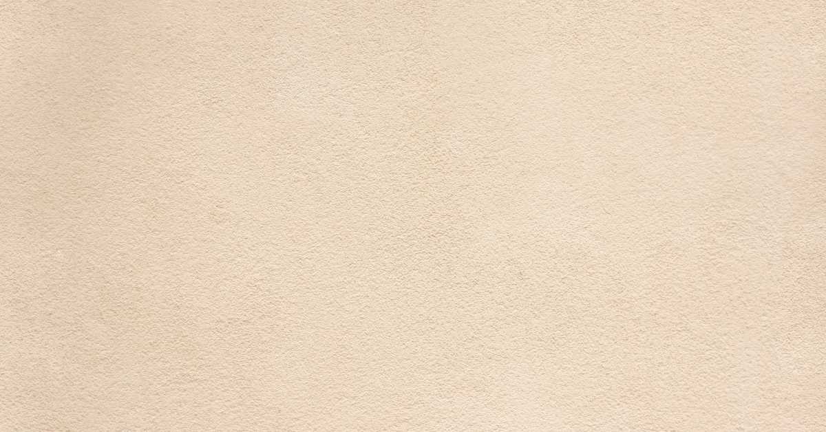 Close-up of smooth beige plaster wall surface