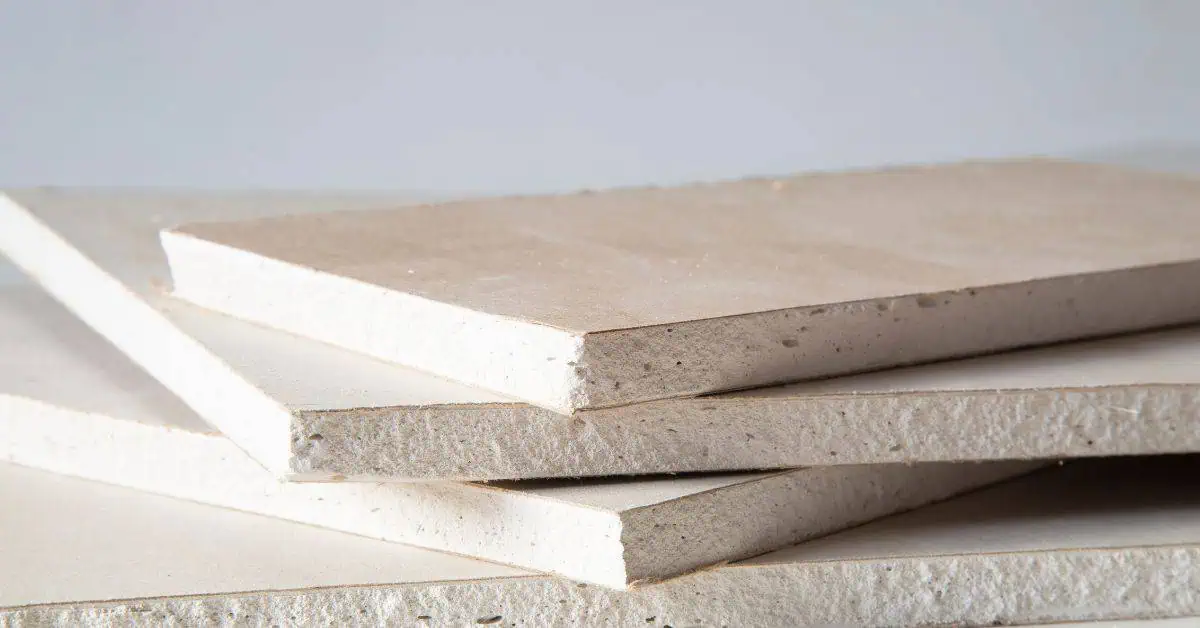 Stacked plasterboard panels with visible edges and texture