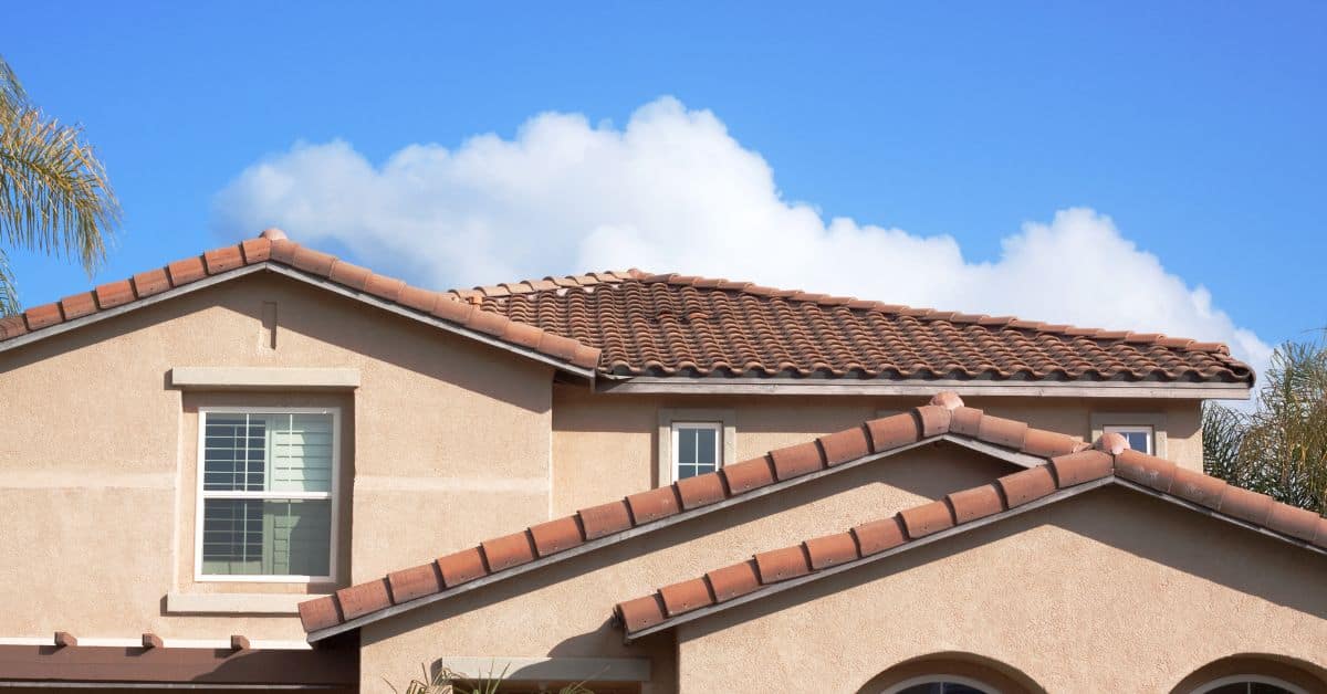 Stucco exterior walls and tile roof of residential house