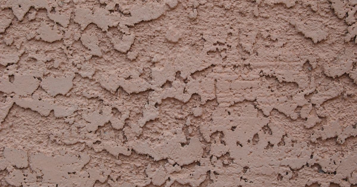 closeup of a textured brown stucco wall surface