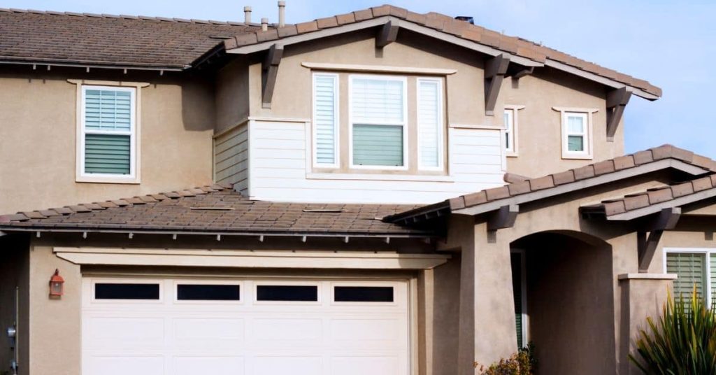 Residential exterior wall with stucco finish and windows