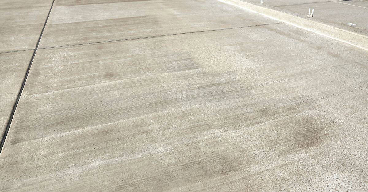 Smooth concrete slab with visible control joint lines