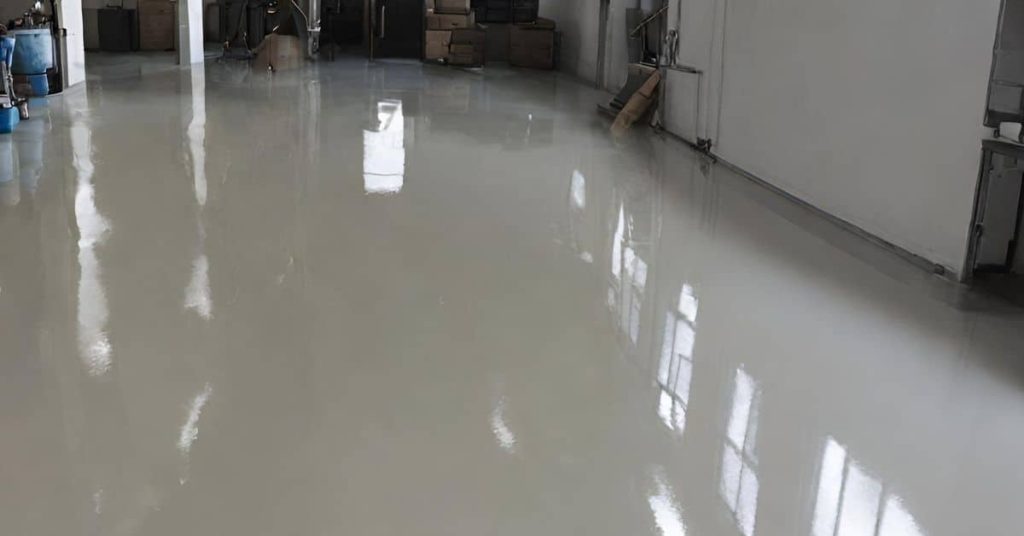 Smooth shiny epoxy coated floor inside industrial space