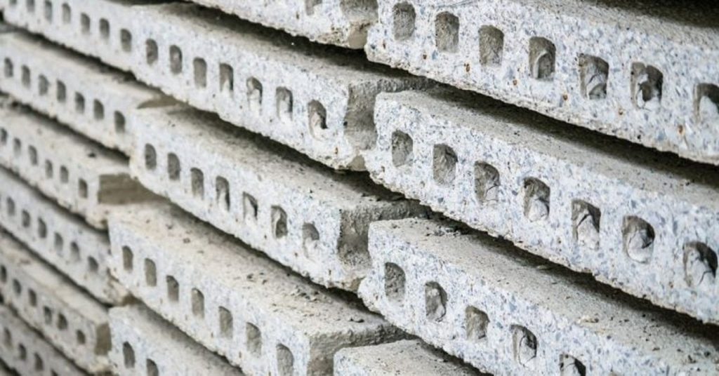 Stacked hollow core concrete slabs close up