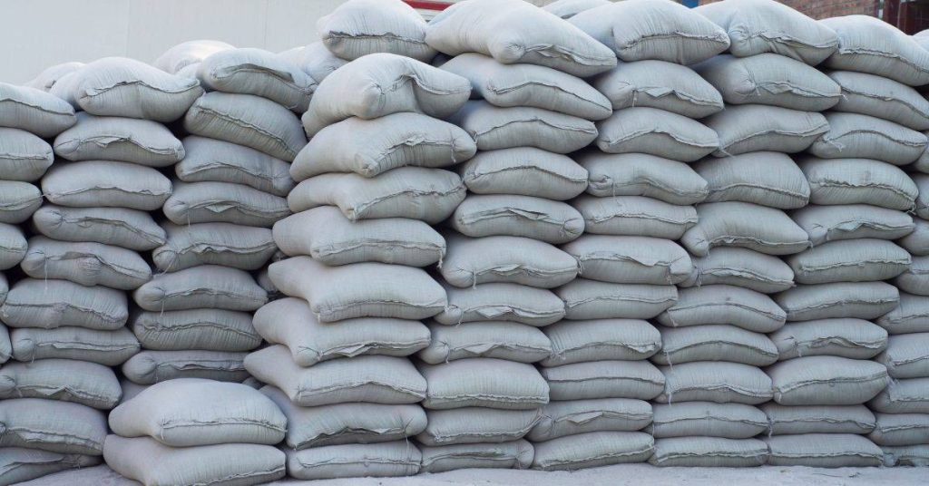 Stacked white bags in an outdoor storage area