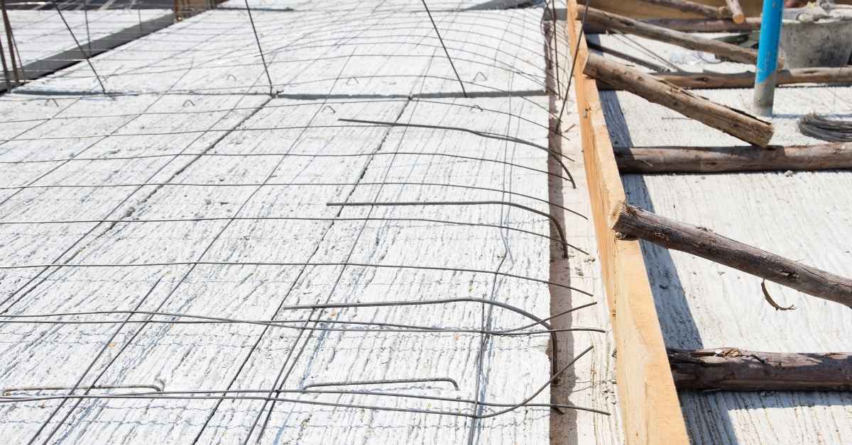 Wire tie rebar grid laid on concrete slab formwork