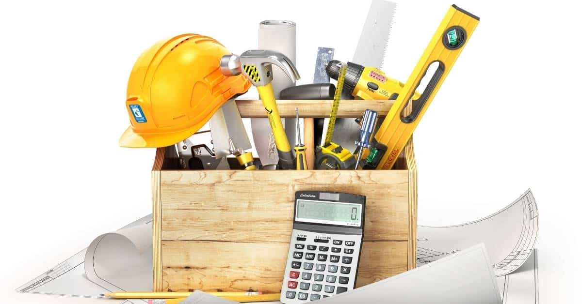 Wooden toolbox with construction tools helmet calculator and blueprints