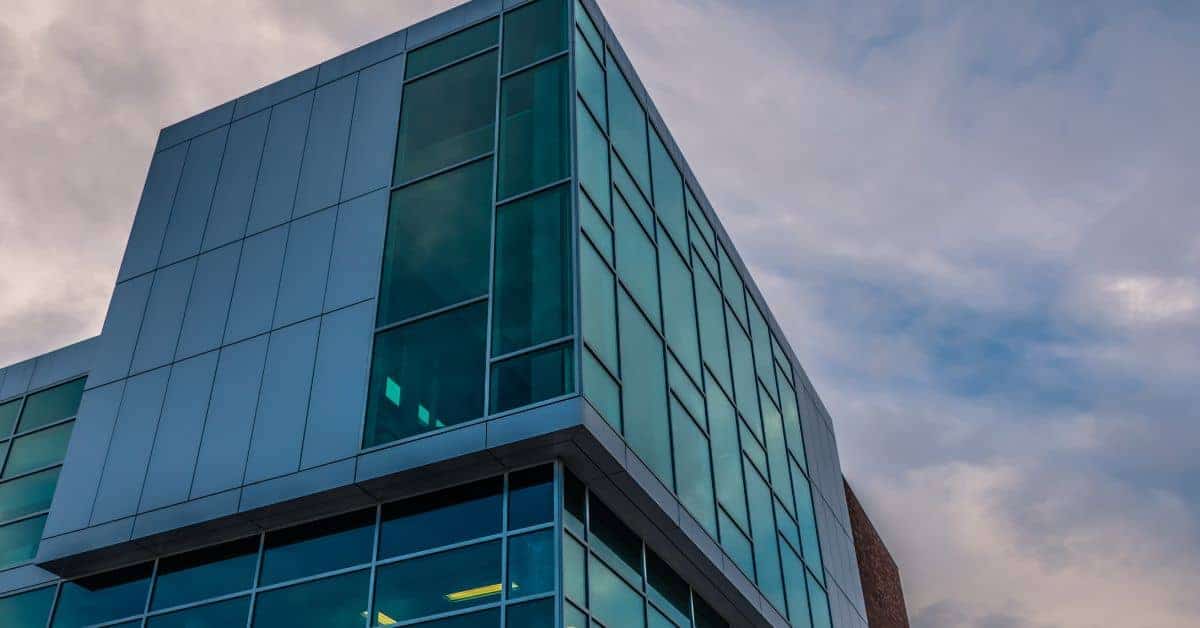 corner of modern building with glass panels and metal framing