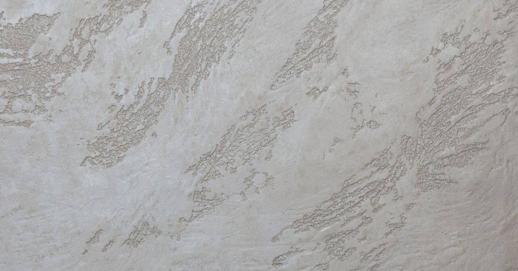 Textured clay plaster wall with subtle pattern