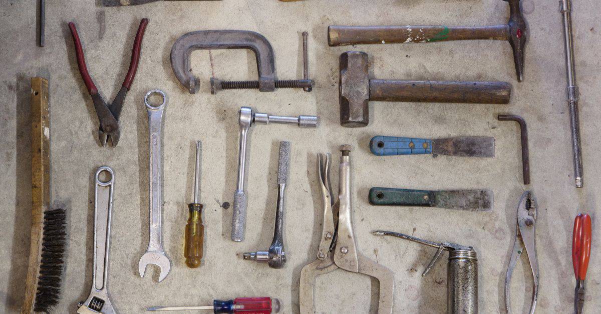 Various hand tools including wrenches pliers hammers and screwdrivers