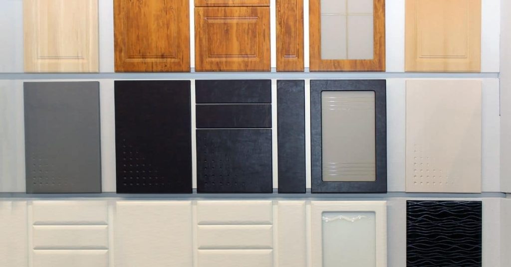 Various painted cabinet door samples in multiple colors and finishes