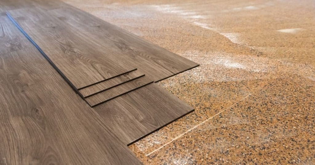 Vinyl plank flooring being installed on subfloor