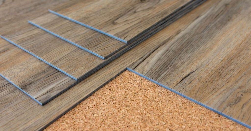 vinyl plank flooring pieces overlapped on cork underlayment