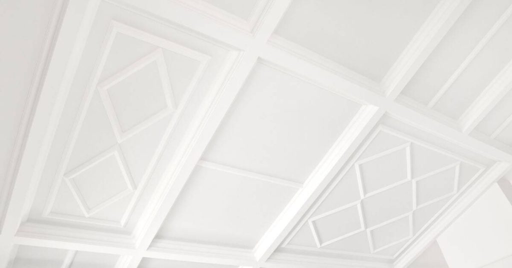 white decorative plaster ceiling panels with geometric patterns
