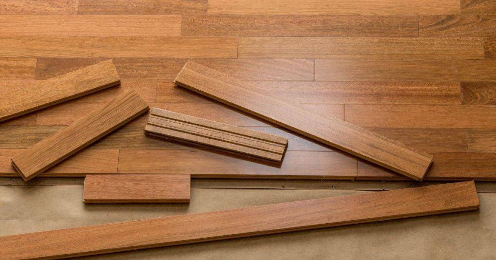 Wooden hardwood flooring boards arranged on subfloor