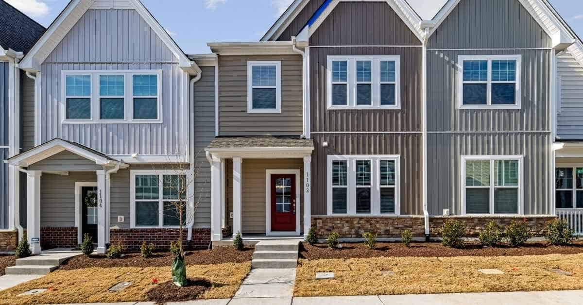 Row of modern townhouses with various siding materials