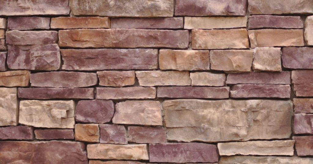 Close-up of stacked stone veneer wall in various brown shades