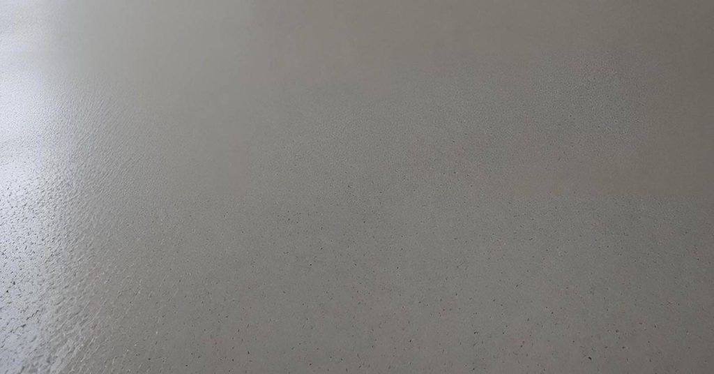 Closeup of freshly poured concrete surface with smooth texture