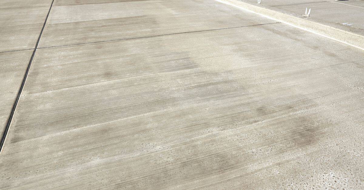Smooth poured concrete driveway slab with expansion joints