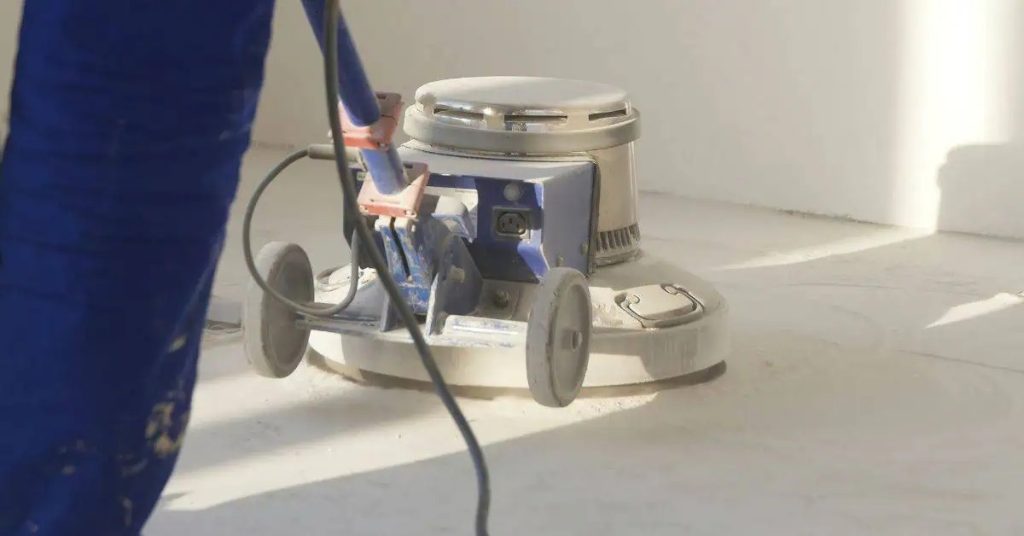 Concrete floor polishing machine on smooth concrete surface