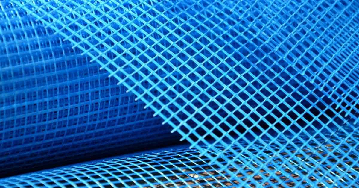 close-up of blue fiberglass mesh rolls for plaster backing