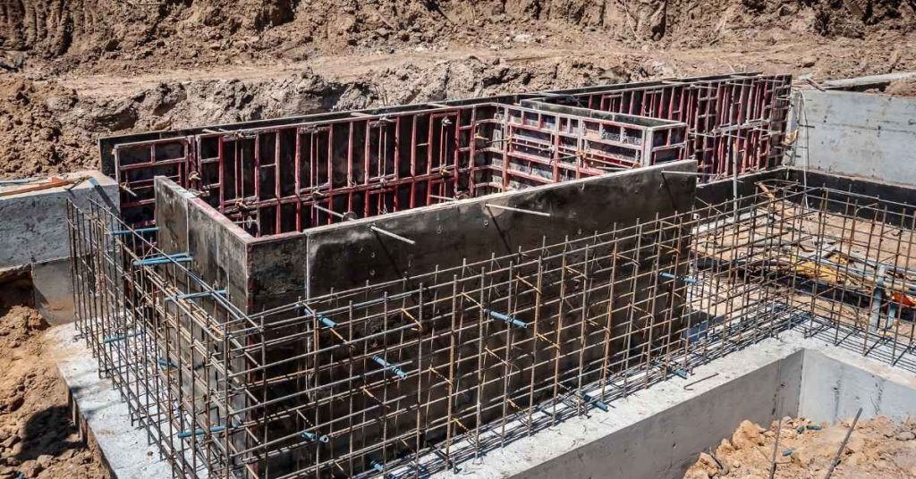Reinforced concrete foundation with metal formwork and rebar