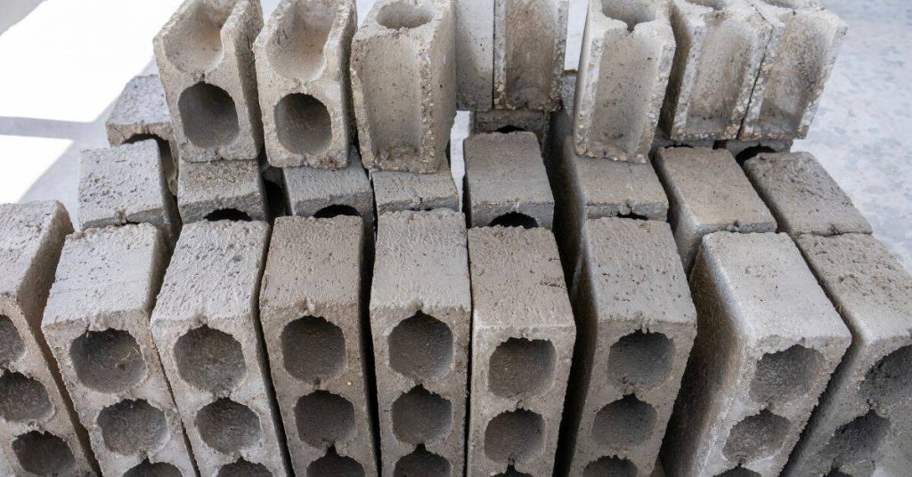 stacked hollow concrete blocks in various shapes and sizes
