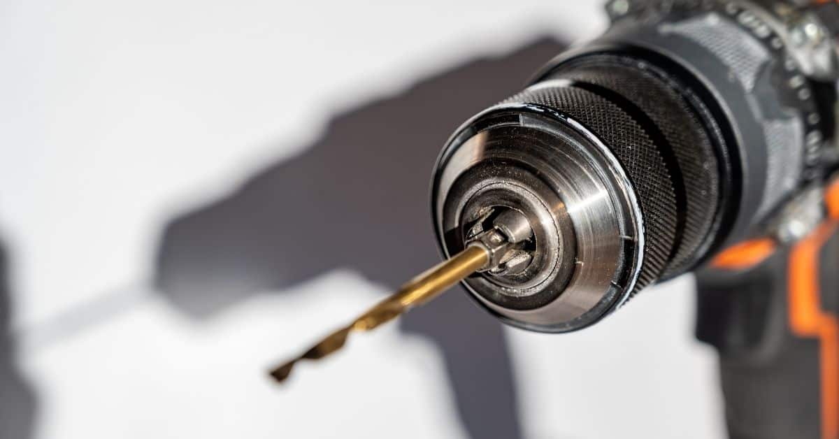 Closeup of power drill with drill bit attached