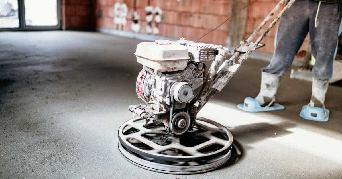 Concrete power trowel machine in use on indoor floor